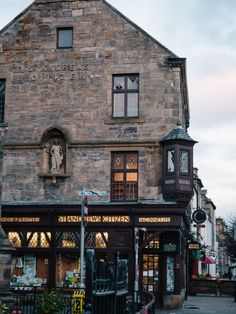 an old building with a clock on the front