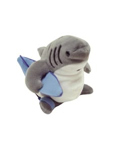 a stuffed shark holding a blue and white object