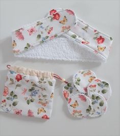 three pieces of cloth with flowers on them