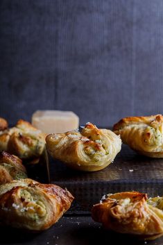 several pastries sitting on top of a metal pan