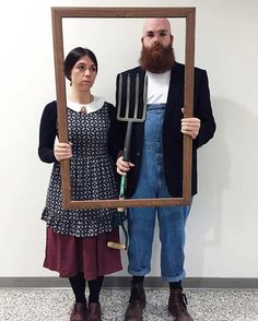 a man and woman are standing in front of a mirror holding utensils,