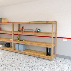 a room with shelves and tools on the floor