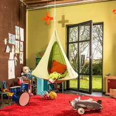 a child's playroom with toys on the floor