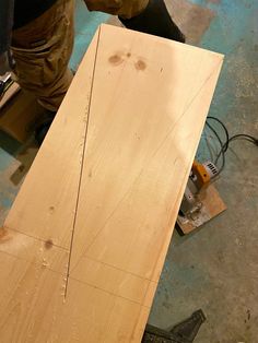 a person working with wood in a workshop