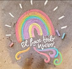 a chalk drawing with the words el hace todo nevo and a rainbow