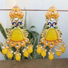 Fancy Party Wear Traditional Earrings. Perfect with ethnic & traditional wear. Perfect gift for any occasion for yourself and your dear ones. It is advisable to store jewellery in a zip lock pouch (air tight pouch), keep away from water perfume and other chemicals and clean it with dry and soft cloth. Cheap Traditional Yellow Earrings, Yellow Traditional Earrings, Handmade Gold Chandelier Earrings For Diwali, Drop Earrings For Diwali And Wedding, Elegant Yellow Earrings For Festivals, Yellow Drop Earrings For Celebration, Yellow Drop Earrings For Festive Occasions, Elegant Yellow Jhumkas For Festive Season, Yellow Jewelry With Latkans For Celebration