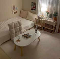 a living room with a couch, coffee table and other items on the carpeted floor