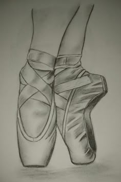 a pencil drawing of a ballerina's feet with their shoes tied up to each other