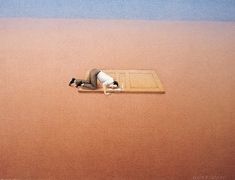 a man laying on top of a sandy beach next to the ocean