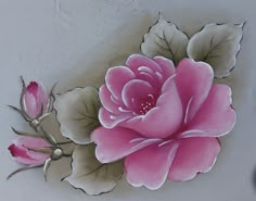 a pink flower painted on the side of a wall