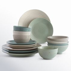 a stack of plates and bowls sitting next to each other