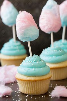 blue and pink cupcakes with marshmallows on top