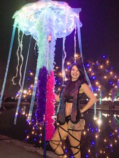 This is a jellyfish umbrella with led lights. (Does not include pole. Extendable pool cleaners used in the pictures)  Can be used for music festivals as a totem or decoration in home. Can be made with most colors- and can add a variety of different colors for the feather boas. LEDs can flash multiple patterns, come with remote, and take two AA batteries. If you have an event this needs to be done for, please specify. Festival Umbrella Diy, Rave Totems, Jellyfish Umbrella, Umbrella Jellyfish, Clown Costume Women, Led Costume, Feather Boas, Diy Kandi Bracelets, Rain Accessories