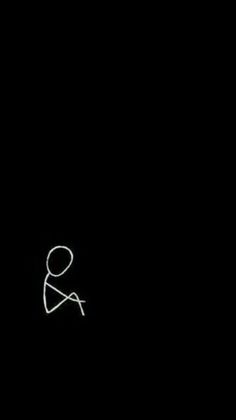 an image of a person holding a knife in the dark