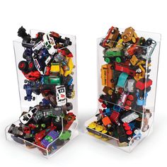 two clear acrylic boxes filled with legos on white background in front of each other