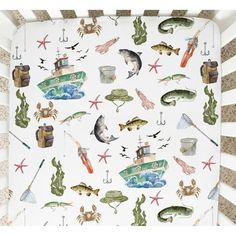 a baby crib with marine animals and fish on it