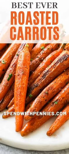 roasted carrots on a white plate with the words best ever roasted carrots