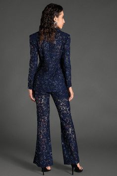 Elegance meets allure in our beaded sequin lace blazer set. This exquisite set features a blazer adorned with intricate beadwork and shimmering sequins, paired with matching tailored trousers. The delicate lace overlay adds a touch of elegance and femininity, making this ensemble truly captivating. Ideal for glamorous events, cocktail parties, or upscale dinners, this blazer set ensures you stand out with grace and style. Handmade customization Fabric composition: 90% polyester fiber, 10% spande Fitted Sequin Suits For Night Out, Luxury Long Sleeve Pantsuit For Party, Festive Formal Lace Sets, Evening Sets With Notch Lapel For Fall, Luxury Party Sets For Spring, Elegant Blue Sequined Sets, Glamorous Sequined Suits For Night Out, Elegant Blue Sets With Sequins, Chic Embellished Evening Suit