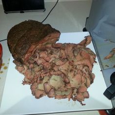 a large piece of meat on a cutting board