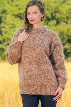 Ready to ship mohair sweater by SuperTanya Brand:  SuperTanya; Style: hand knitted mohair sweater; Material: premium class mohair; Color: Brown and beige; Design: Plain design mohair sweater; Size L-XL Body length, measured from the shoulder top to the bottom end: 27.6" / 70 cm; Chest width, measured at the back, between the underarms: 21.7″ / 55 cm; Sleeve length, measured from the neckline to the end of the cuff: 27.6″ / 70 cm Net weight: 0.830 kg. The lady modeling is 5'8'' (174 cm) tall, bus Beige Mohair Long Sleeve Sweater, Brown Mohair Knitted Sweater, Beige Mohair Winter Sweater, Beige Mohair Sweater For Fall, Beige Mohair Soft Knit Sweater, Brown Alpaca Crew Neck Sweater, Hand Knitted Mohair Sweater In Beige, Cozy Hand Knitted Brown Sweater, Cozy Hand-knitted Brown Sweater