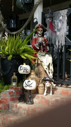 a statue of a skeleton sitting on top of a wooden bench next to a potted plant