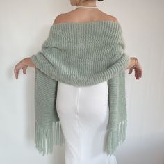 Wedding sage green shawl This versatile sage green wrap piece not only complements any outfit but also provides warmth and protection from the chilly weather throughout fall, winter, and spring. These cover up's make an excellent bridesmaid gift. Fuzzy and warm yarn. it is not itchy at all. My proucts are handmade. MATERİAL: 10% mohair, 10% wool, 80% premium acrylic-Polyamid, COLOR:SAGE GREEN  (PALE MİNT)  AS SHOWN MEASUREMENTS: (Average) Length: 67'' (170 CM) Width:20'' (50 CM) (without fringes Vert Pale, Winter Wedding Shawl, Fall Winter Wedding, Green Shawl, Fuzzy Scarf, Faux Fur Shawl, Knitted Scarves, Bridal Cover Up, Green Wrap