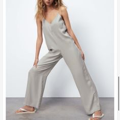 Nwt Zara Flowy Jumpsuit Stock Photos By Zara Zara V-neck Jumpsuits And Rompers For Loungewear, Elegant Sleeveless Silver Jumpsuits And Rompers, Red Leather Leggings, Gray Jumpsuit, Flowy Jumpsuit, Grey Jumpsuit, Zara Collection, Zara Jumpsuit, Sequin Rompers