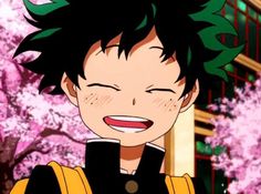 an anime character with black hair and green leaves on his head, smiling at the camera