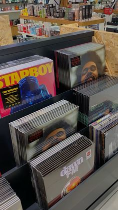 many cds are on display in a store