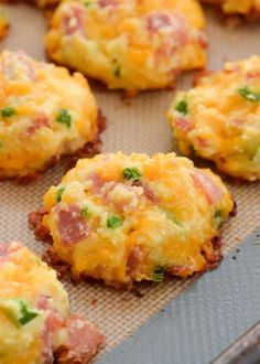 some food is sitting on a baking sheet and ready to be cooked in the oven