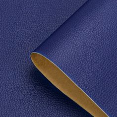 a blue leather background with a gold edge