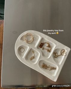 a tray with rings and jewelry on it