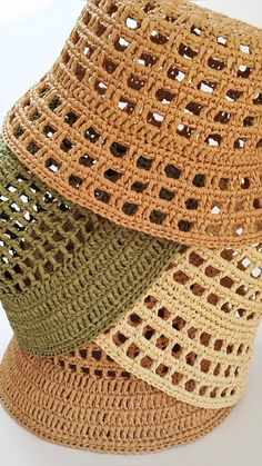 three crocheted hats sitting on top of each other