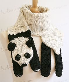 a crocheted panda bear scarf on a mannequin