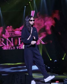 a woman standing on top of a stage