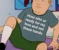 a man sitting on top of a bed wearing a t - shirt that says humu won't ur ready for my love and not these hands