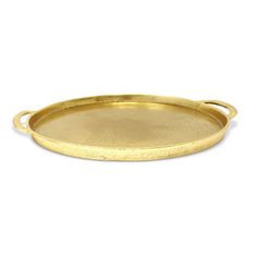 an oval brass tray with handles on a white background, it is empty and ready to be used as a serving platter