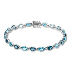 Keep life colorful with the happy hue and standout style of this gemstone bracelet. The timeless silhouette features links of brilliant pear-shaped Swiss Blue topaz alternating with pear-shaped London Blue topaz. Fashioned in stylish sterling silver, the bracelet measures 7.25 inches and secures with a tongue clasp. Topaz Bracelet, Blue Topaz Bracelet, Kay Jewelers, Bracelet Sterling Silver, Topaz Stone, Swiss Blue Topaz, Bracelet Clasps, London Blue Topaz, London Blue