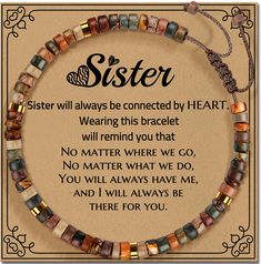 a necklace with the words sister written in black and white on it, surrounded by multicolored glass beads