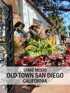 an old town san diego with red wagons full of plants