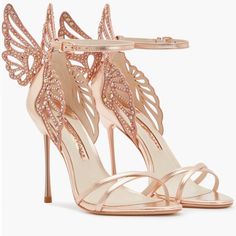 These Heavenly Heeled Sandals Epitomise Sophia Webster's Elegant Aesthetic In Their Rose-Gold Toned Design. Featuring The Brand's Signature Butterfly Detailing At The Heart Of The Style, Crystal Embellishments Adorn The Pair For An Elevated Decadent Touch.