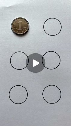 a penny sitting on top of a piece of paper with circles around it and an arrow pointing