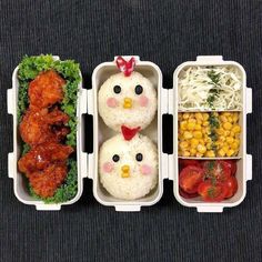 three plastic containers filled with rice, meat and veggies covered in chicken faces