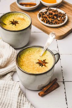 two mugs filled with different types of spices