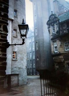 an old fashioned street light on a rainy day