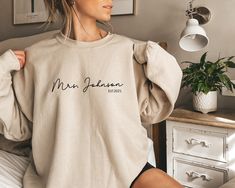 personalized gift for bride, wedding gift, honeymoon pajamas, bride to be gift, custom bridal gift, bride t-shirt, future mrs tee DETAILS Gildan Sweashirt Our sweatshirts are SUPER soft and SUPER comfy. They do RUN BIG! Make sure to choose your size accordingly! FABRICATION 8 oz.(US) 13.3 oz.(CA), 50/50 preshrunk cotton/polyester MATERIALS High quality heat transfer professionally heat press CARE INSTRUCTIONS Machine wash Do not iron directly on letters PERSONALIZATION We absolutely love customi Weekend Mode, Boho Svg, Mrs Sweatshirt, V Neck Shirts, Motivational Svg, Mama Sweatshirt, Mom Sweatshirt, Look Plus, Iowa