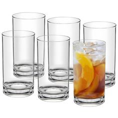 four glasses filled with different types of drinks