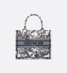 Introduced by Maria Grazia Chiuri, Creative Director of Christian Dior, the Dior Book Tote has become a staple of the Dior aesthetic. Created to hold all the daily essentials, the white style is fully embroidered with the denim blue Dior Chardons motif by Pietro Ruffo, showcasing the national flower of Scotland, which symbolizes protection, resilience and freedom. Adorned with the contrasting Christian Dior Paris signature on the front, the small tote exemplifies the House's savoir-faire and can Dior Zodiac, Dior Tote Bag, Marie Stuart, Dior Aesthetic, Dior Book, Christian Dior Paris, Dior Paris, Christian Dior Fashion, Dior Book Tote