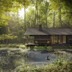 a house in the woods with a pond