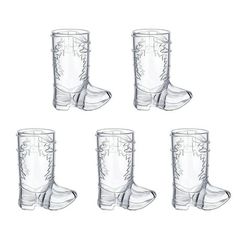 six clear glass cups with cowboy boots on the bottom and one is filled with water